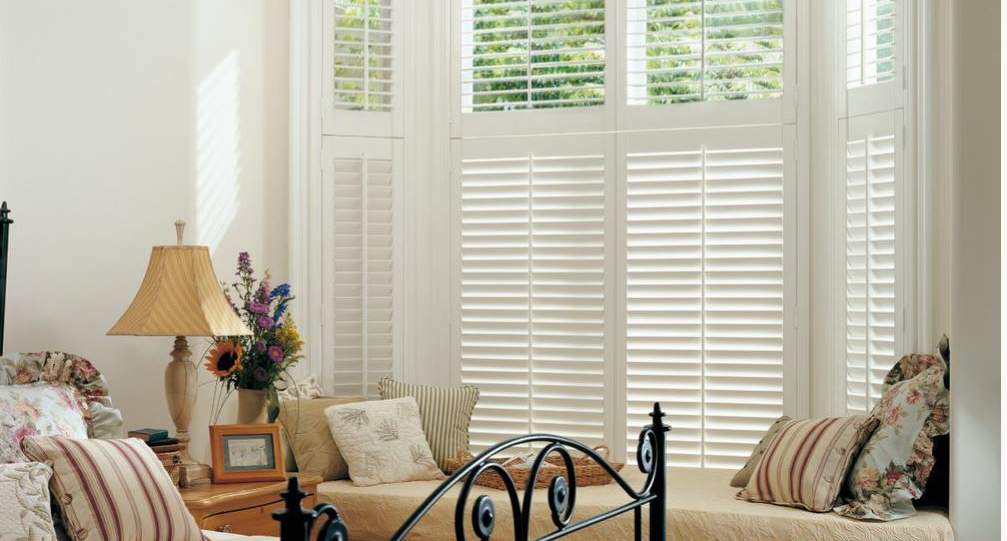 Cafe style shutters in bedroom